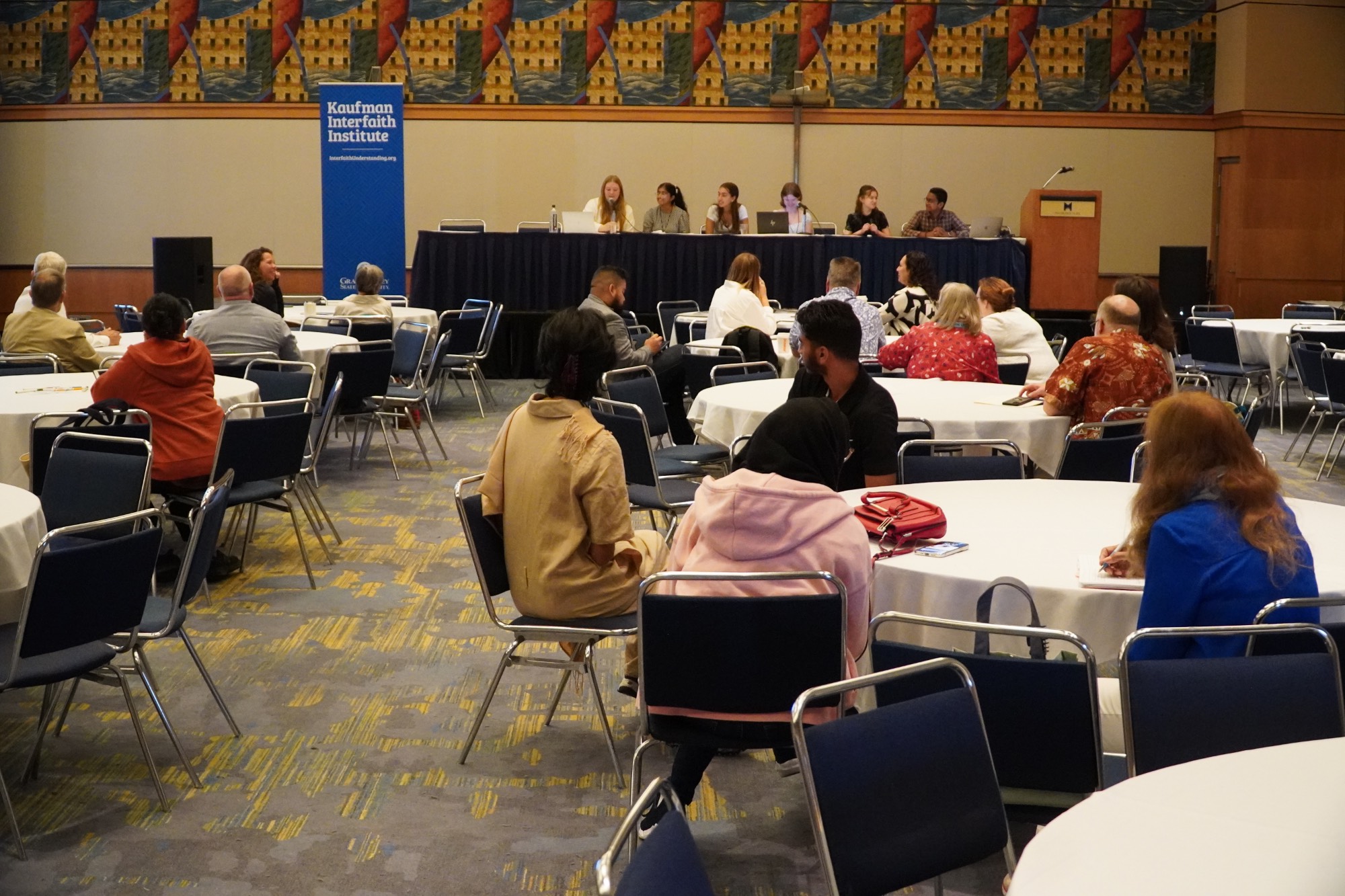 Room full of people at Scholar's presentation